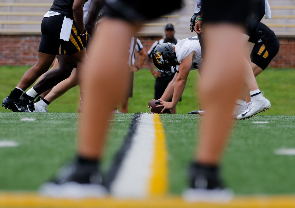 The Missouri offensive line practices its snap during practice